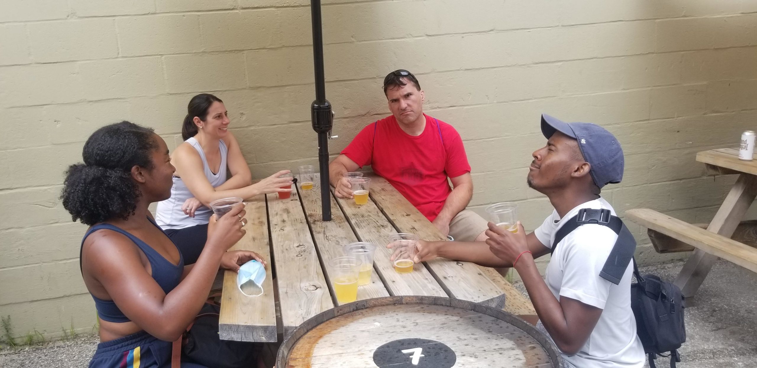 a group of people sitting at a table with a knife