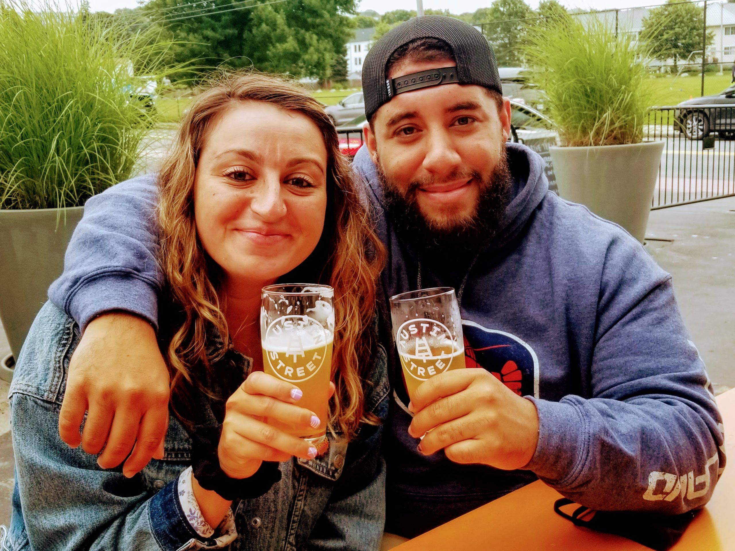 a person holding a glass posing for the camera