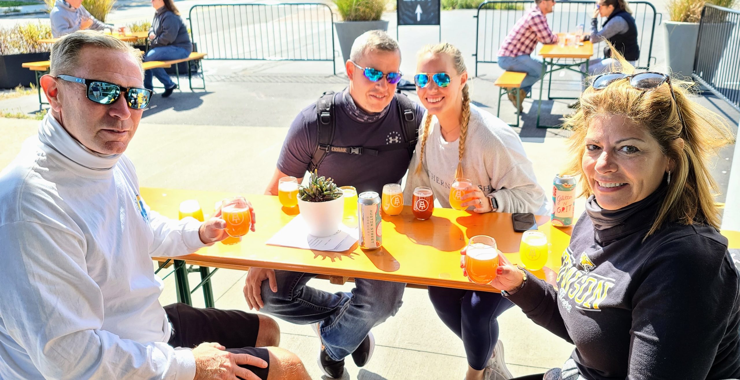 a group of people are drinking from a glass