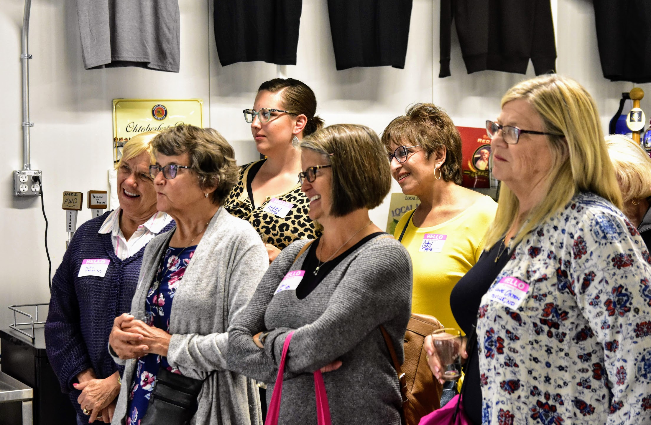 a group of people standing in a room