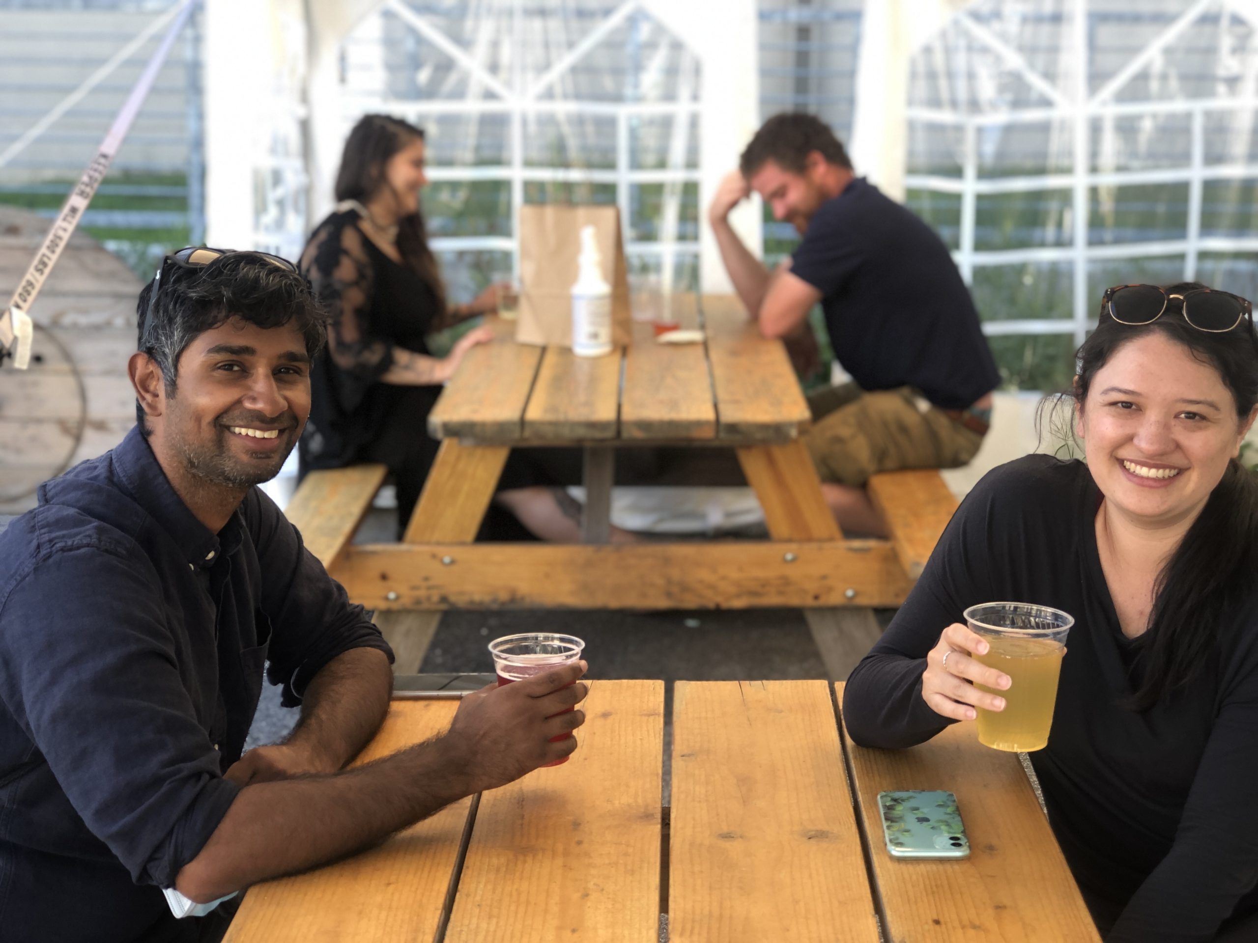 a group of people sitting around a wooden table