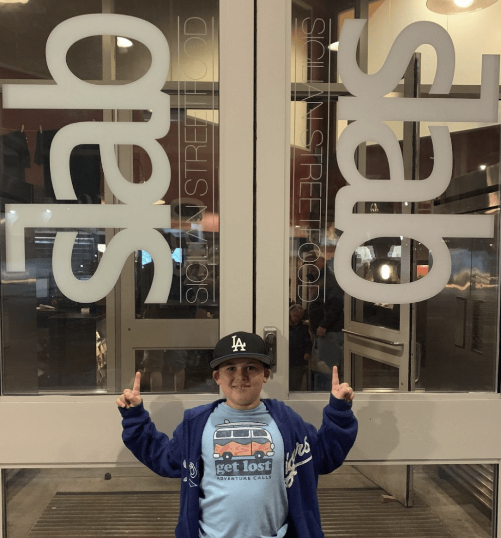a man standing in front of a store