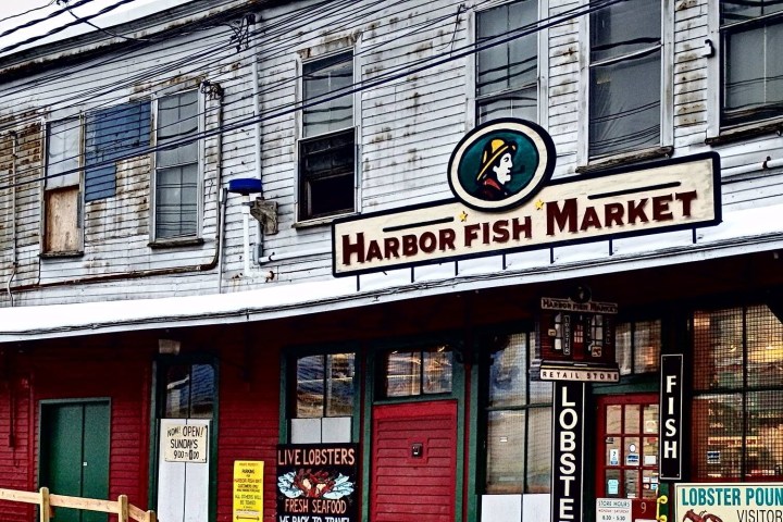 Harbor Fish Market building with seafood signage and rustic facade.