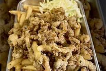 Tray with fried chicken, French fries, and coleslaw.